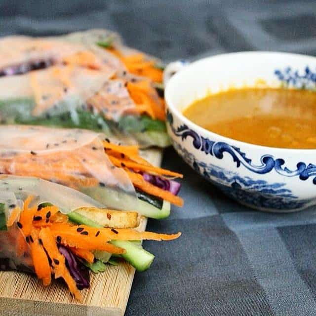 Crunchy spring rolls with a spicy coconut and red curry peanut sauce