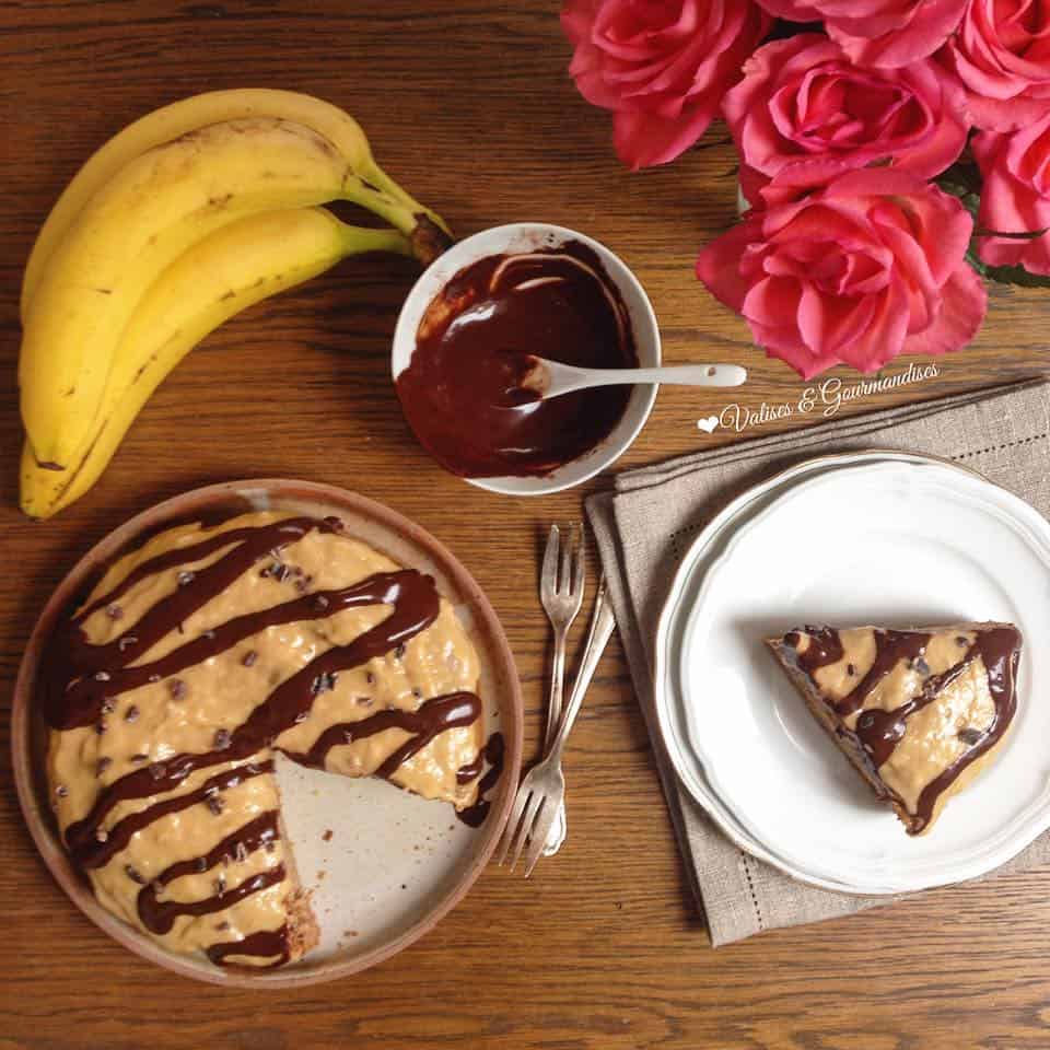 Healthy banana cake with peanut butter frosting and raw maca chocolate sauce