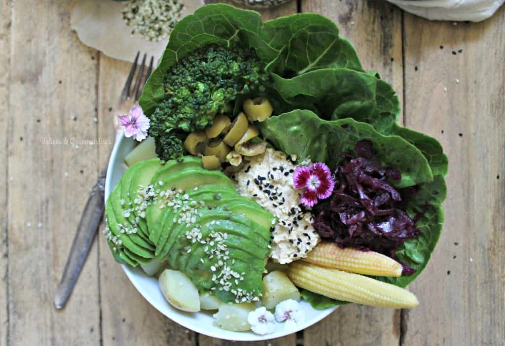 Summer Buddha bowl with steamed potatoes and hummus