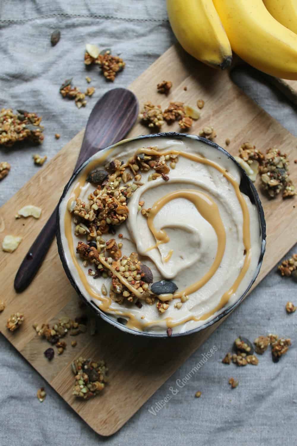 chunky monkey granola on a bowl of nice cream, seen from above