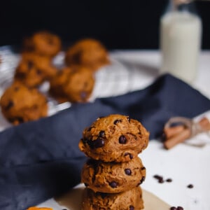 three pumpkin cookies piled up