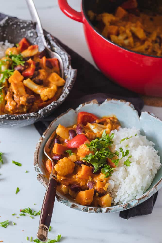 vegan sweet potato curry in two bowls with rice